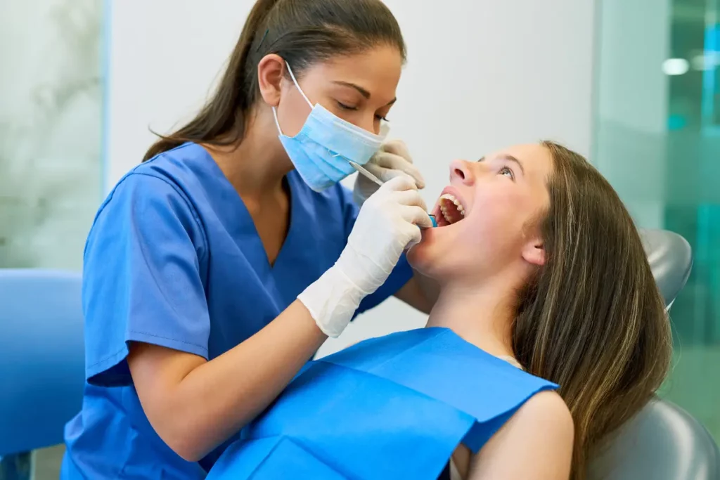 dental assistant helping out patient