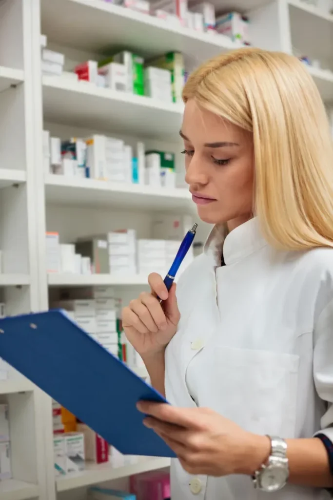 pharmacy technician looking at document