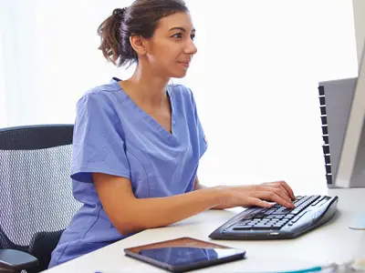 healthcare worker using a computer at work