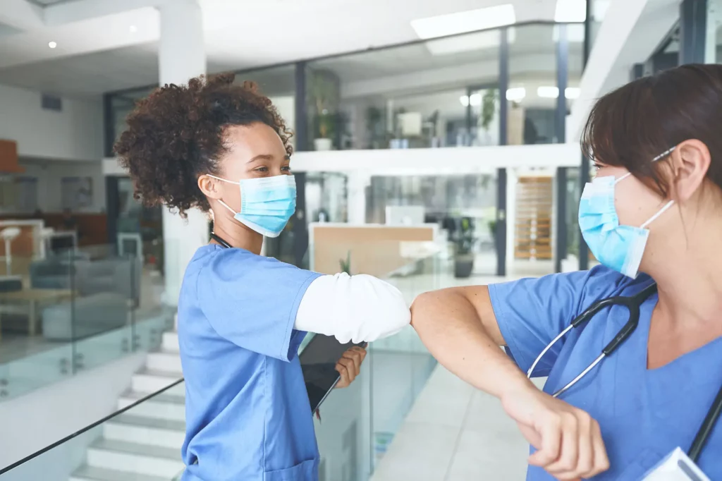 medical assistants greeting each other